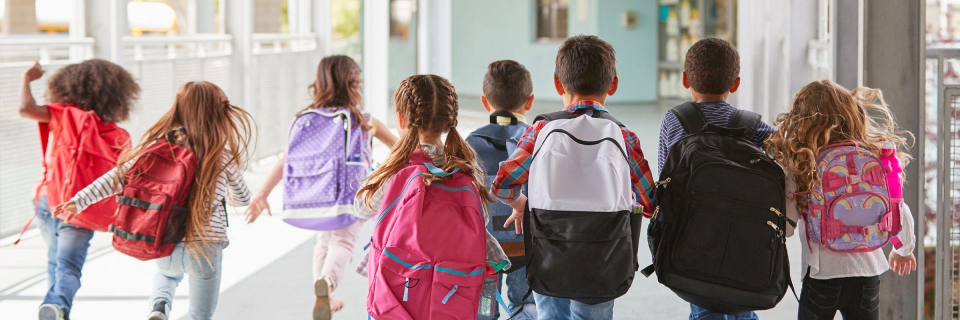 group of school children with backpacks